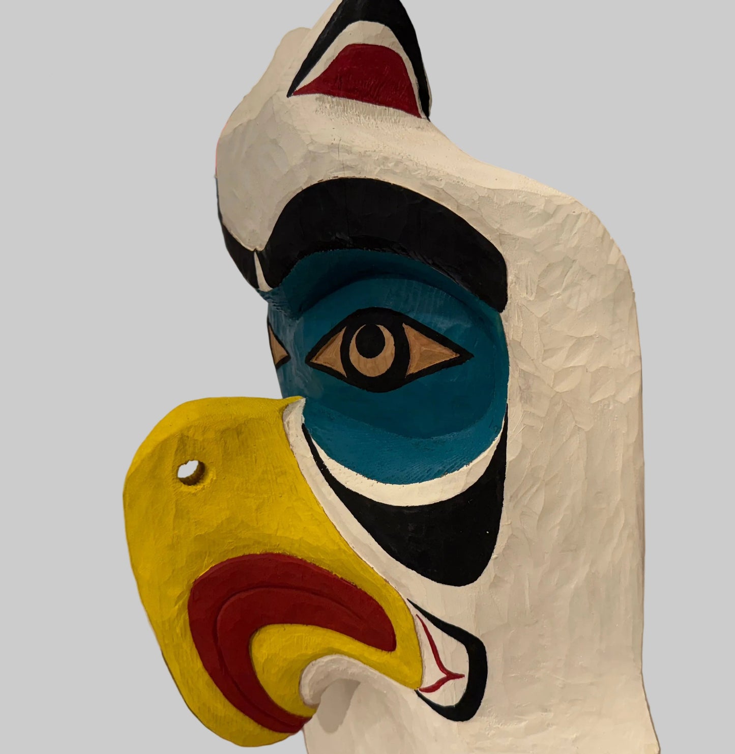 A Striking Thunderbird and Whale Totem Pole