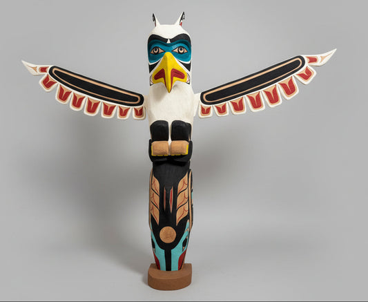 A Striking Thunderbird and Whale Totem Pole