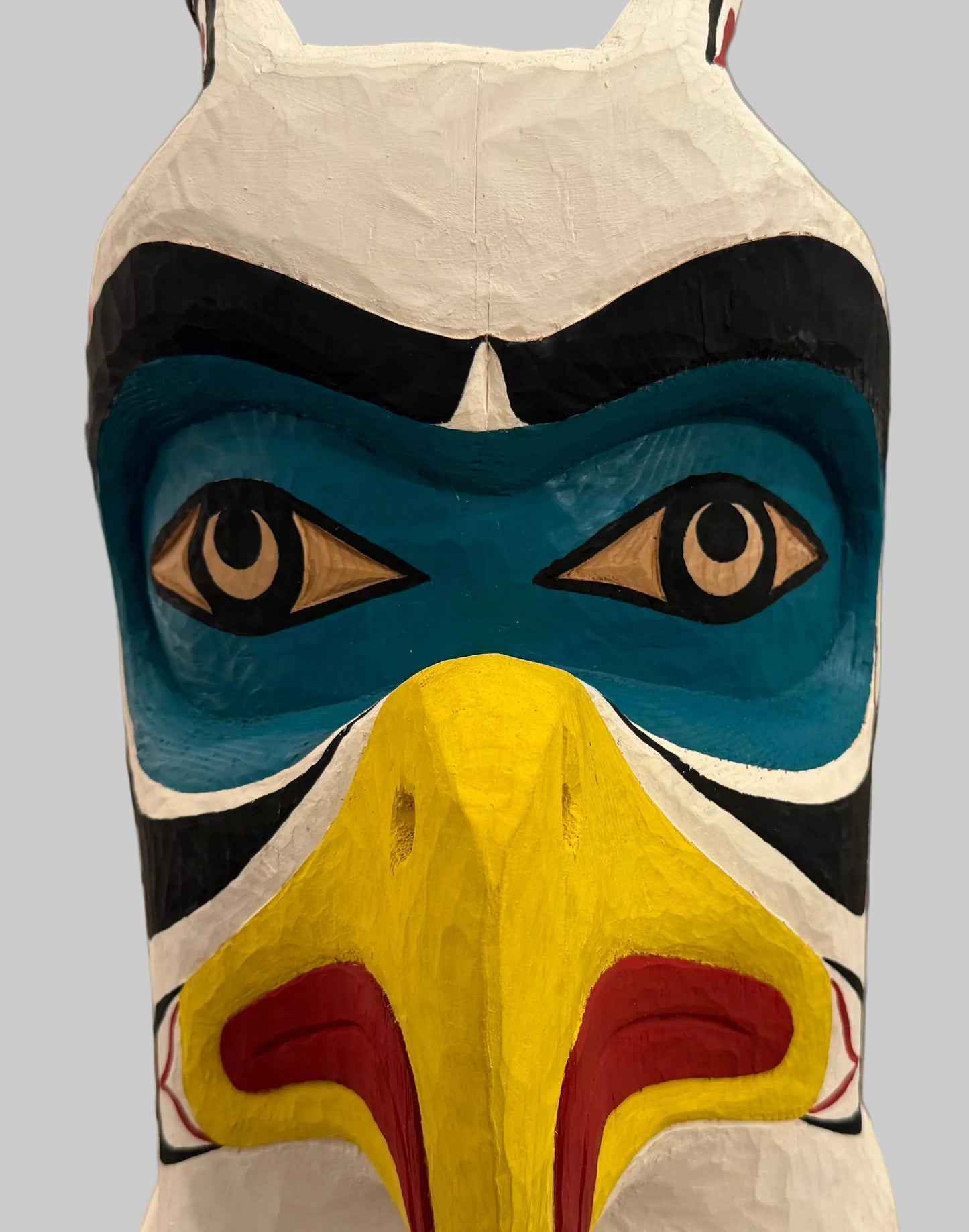 A Striking Thunderbird and Whale Totem Pole