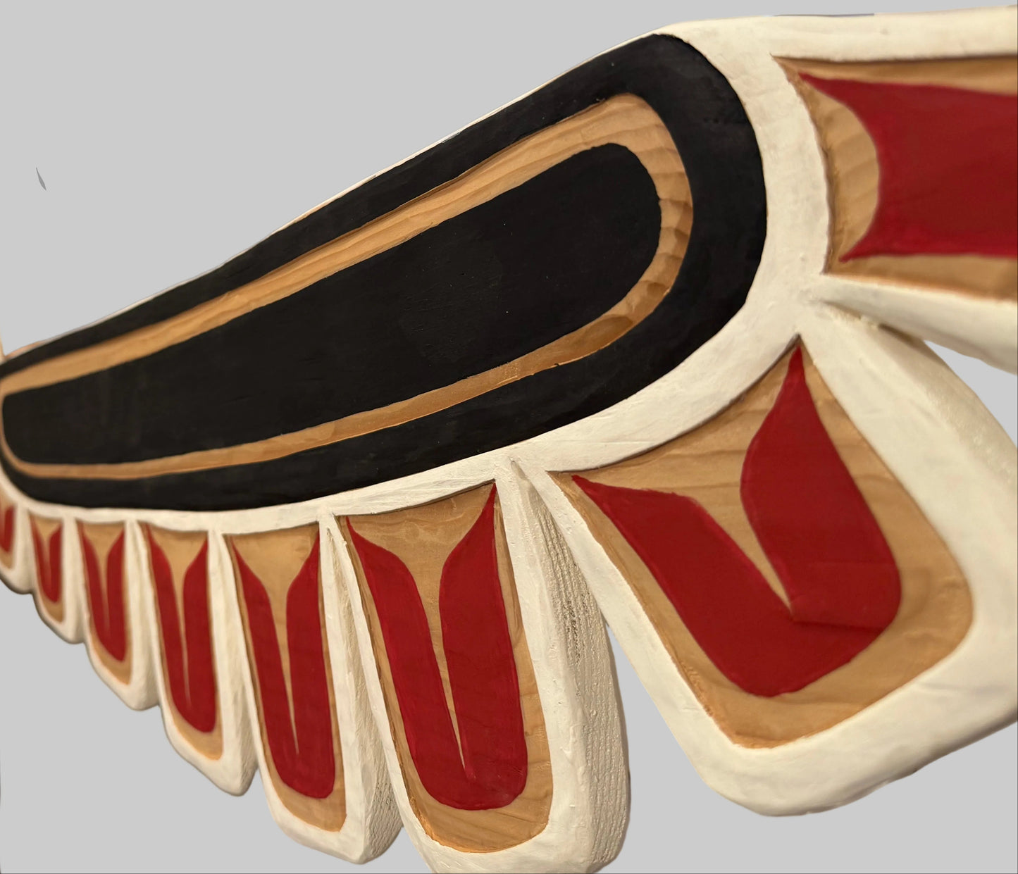 A Striking Thunderbird and Whale Totem Pole